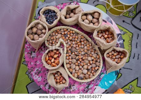 Mix Of Hazelnut And Walnuts With Hard Shell . Dried Hazelnuts And Walnuts, Closeup . Hazelnuts, Waln