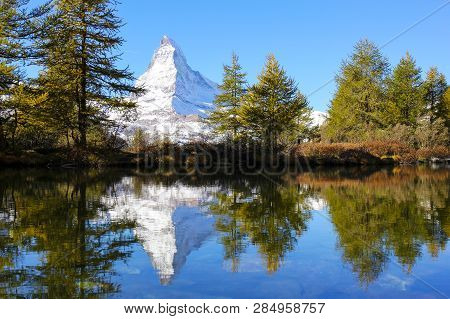 Matterhorn (the Famous Alps Peak) Reflection On Grindjisee Lake In Autumn , Zermatt, Switzerland