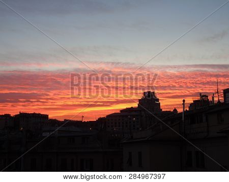 Genova, Italy - 02/12/2019: An Amazing Caption Of The Sunset Over The City Of Genoa In Winter Days C