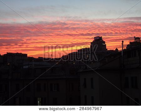Genova, Italy - 02/12/2019: An Amazing Caption Of The Sunset Over The City Of Genoa In Winter Days C