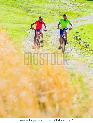 African Children Riding A Bike In Rural A Village