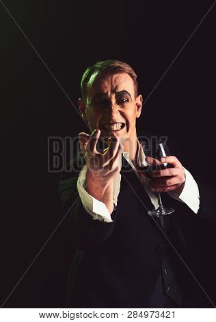Hate. Comedian With Mime Makeup Hold Wine Glass. Mime Man. Mime Artist Perform On Stage. Stage Actor