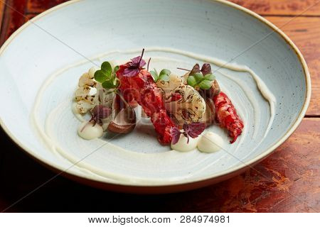 gourmet dish with praws, shitake mushrooms and cauliflower