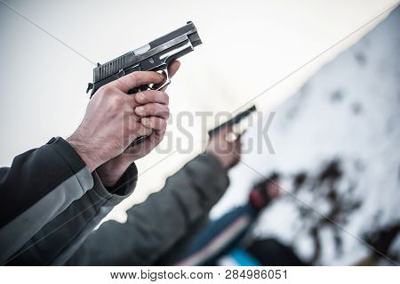 Close-up View Of Shooter Practice Handgun Shooting In Row Group