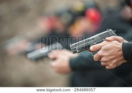 Close-up View Of Shooter Practice Handgun Shooting In Row Group