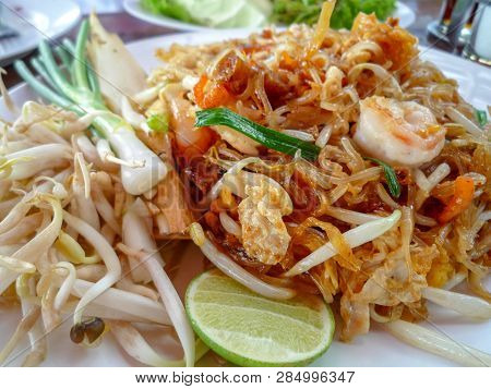 Close Up Of Phad Thai Goong Served With Lime And Bean Sprouts