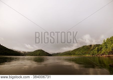 Mirror Smooth Water Of The Carpathian Zetelaka Lake. Beautyful Landscape After Rain