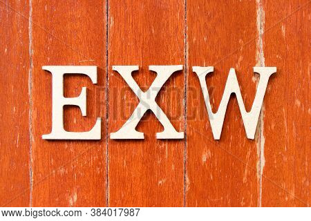 Alphabet Letter In Word Exw (abbreviation Of Ex Works) On Old Red Color Wood Plate Background