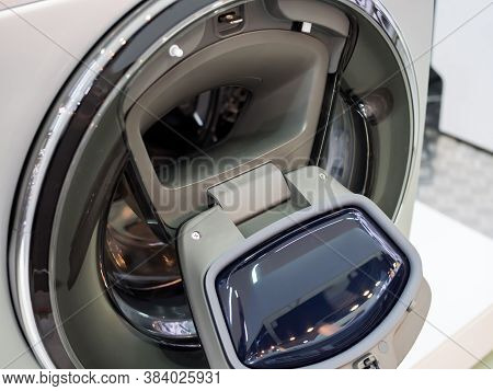 Open Flap In The Door Of The Washing Machine For Adding Laundry