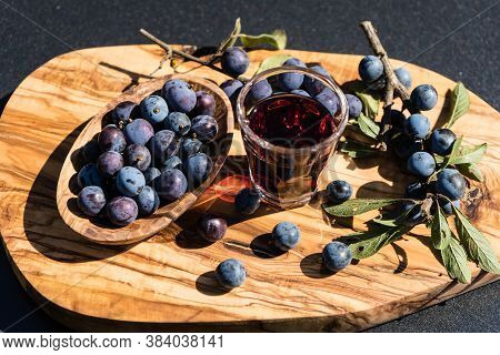 Blue Round Fruits Of The Blackthorn Bush