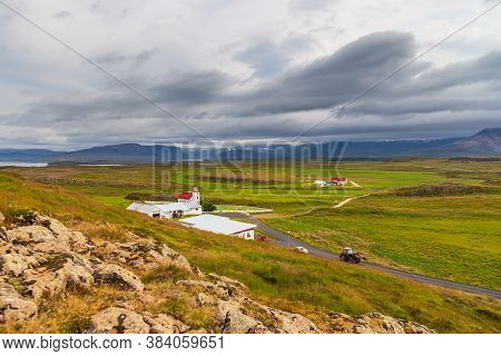 Helgafell, Iceland- 26 August 2015: View Of The Helgafellskirkja Form The Holy Mountain. Western Ice