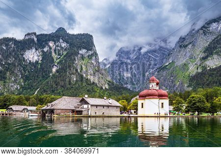 Lake Koenigssee With Pilgrimage Church Saint Bartolomew In The Berchtesgaden Alps, Germany.