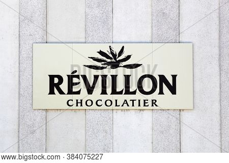 Roanne, France - May 31, 2020: Revillon Logo On A Wall. Revillon Is A French Chocolate Factory Found