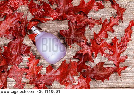 Perfume Bottle Lavender-colored A Matte Surface Lies Beautifully On A Wooden Background Strewn With 