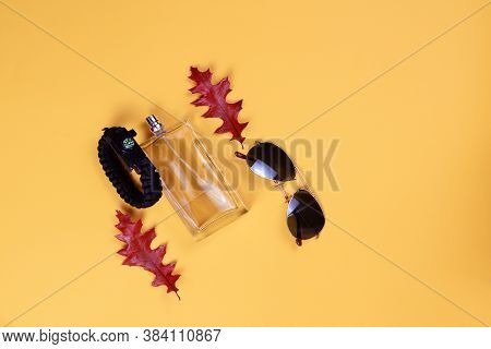 Transparent Bottle With Perfume, Glasses, A Bracelet With A Compass And Knifelie,red Autumn Leaves O