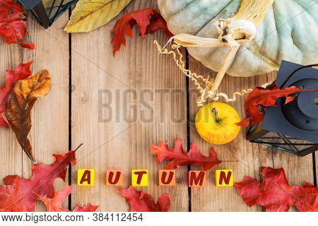 Red Leaves,pumpkin,apple,lamp,inscription Autumn On A Wood Background.symbols Autumn .rustic Backgro