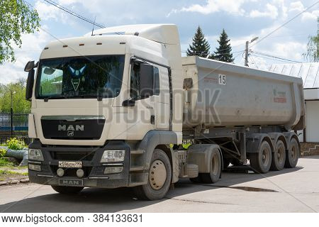 Russia-may 25, 2020. Man Tonar Dump Truck Is Parked On The Square Near The Store.