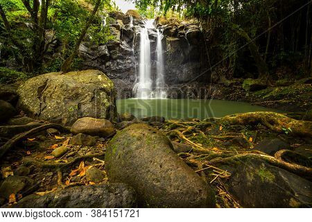 Tropical Landscape. Beautiful Hidden Waterfall In Rainforest. Adventure And Travel Concept. Nature B