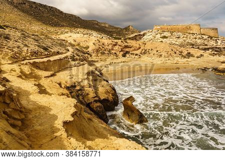 Castle San Ramon Above Beach Of El Playazo, Cabo De Gata Nijar, Province Almer