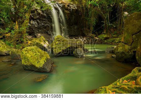 Tropical Landscape. Beautiful Hidden Waterfall In Rainforest. Adventure And Travel Concept. Nature B