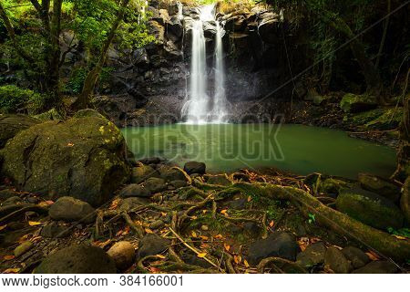 Tropical Landscape. Beautiful Hidden Waterfall In Rainforest. Adventure And Travel Concept. Nature B