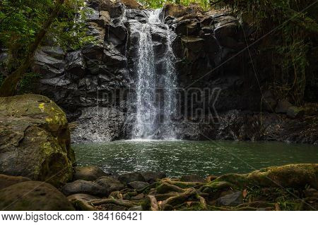 Tropical Landscape. Beautiful Hidden Waterfall In Rainforest. Adventure And Travel Concept. Nature B