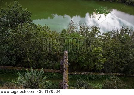 View From The Bitov Castle On The Walls And The Water Level In Which The Reflection Of The Trees Can