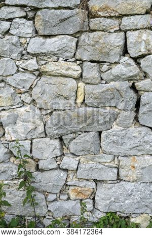 Rock Wall Background. Closeup. Copspace. Natural Gray Texture