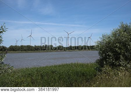 Wind Farm On The Banks Of The Scheldt In Antwerp