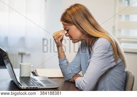 Young Modern Woman Is Working From Home. She Is Having Pain In Her Eyes.
