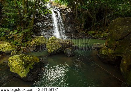 Tropical Landscape. Beautiful Hidden Waterfall In Rainforest. Adventure And Travel Concept. Nature B