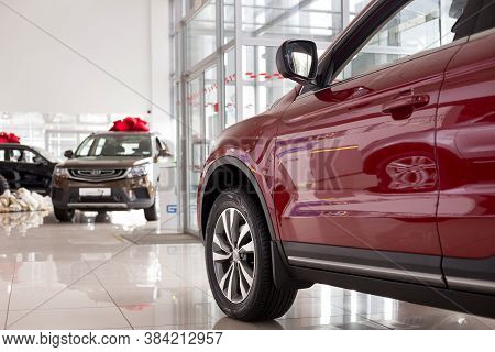 Russia, Izhevsk - August 14, 2020: New Modern Cars In The Geely Showroom. Front And Side View. Car