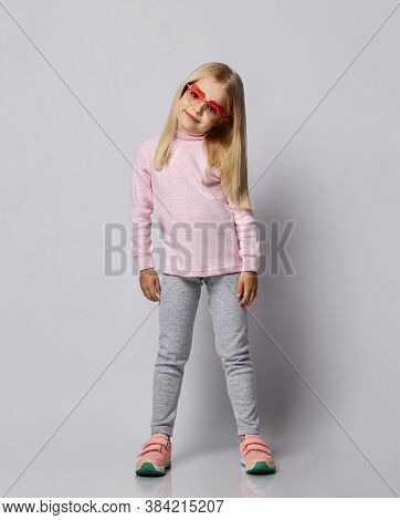 Cute Smiling Blonde Kid Girl In Stylish Smoked Heart-shaped Sunglasses And Wool Thermal Underwear Tu