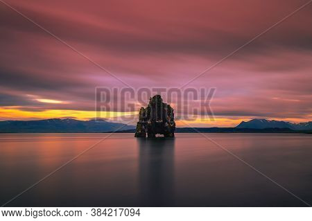 Colorful Sunset At The Hvitserkur Basalt Stack In Northern Iceland. Hvitserkur Is A Spectacular Rock