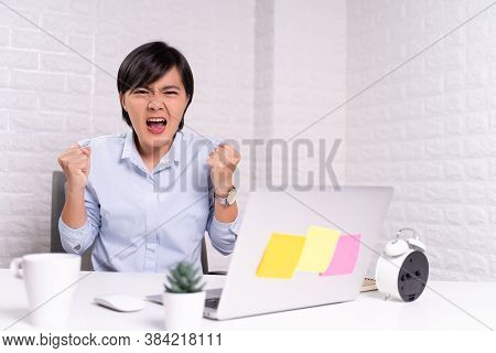 Angry Woman Working At Office Brick Background