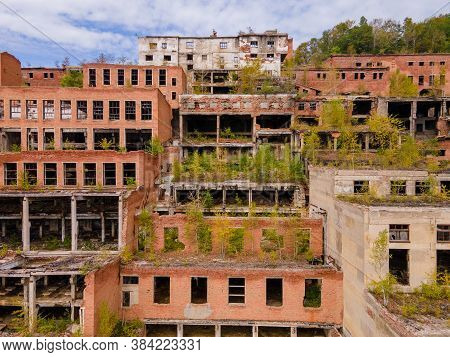 View From Above. Ruined And Abandoned Buildings Of A Tin Mining Factory In The Village Of Kavalerovo