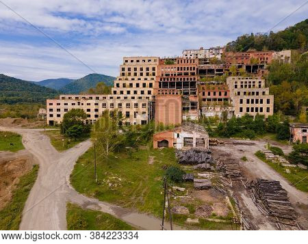 View From Above. Ruined And Abandoned Buildings Of A Tin Mining Factory In The Village Of Kavalerovo