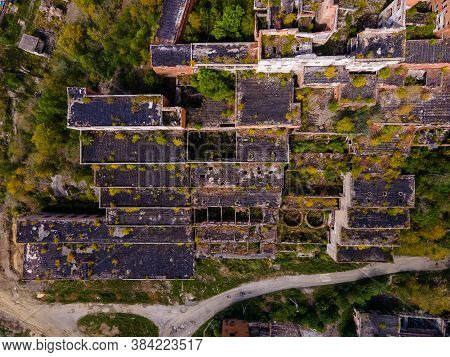 View From Above. Ruined And Abandoned Buildings Of A Tin Mining Factory In The Village Of Kavalerovo
