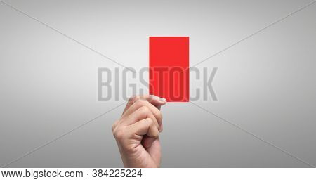 Referee a hand holding  red cards. isolated