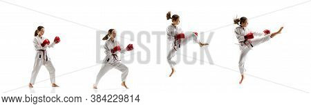 Punching. Junior In Kimono Practicing Taekwondo Combat, Martial Arts. Young Female Fighter With Red 