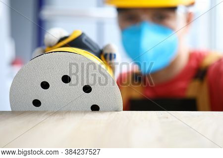 Carpenter In Protective Mask Grinds With Tool. Preliminary Cleaning And Polishing Surfaces. Restorat