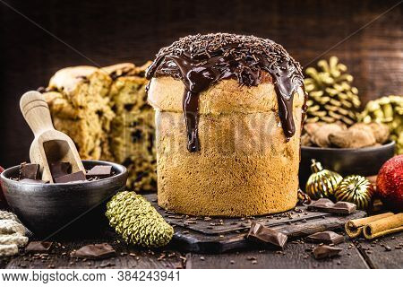 Homemade Panettone Covered In Chocolate And Sprinkles, Called Chocotone. Christmas Bread Served As D