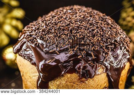 Homemade Panettone Covered In Chocolate And Sprinkles, Called Chocotone. Christmas Bread Served As D