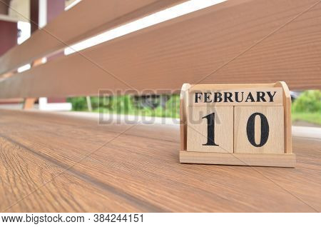 February 10, Number Cube With Wooden Balcony Background.