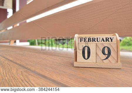 February 9, Number Cube With Wooden Balcony Background.