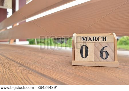 March 6, Number Cube With Wooden Balcony Background.