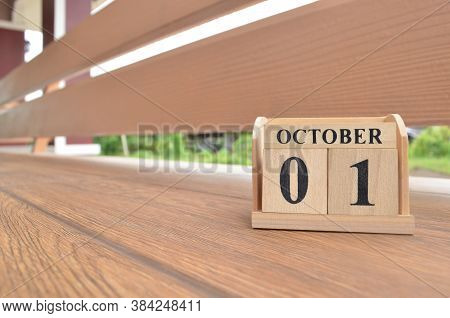 October 1, Number Cube With Wooden Balcony Background.