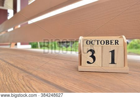 October 31, Number Cube With Wooden Balcony Background.