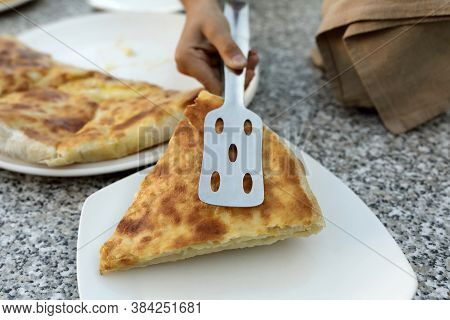 Child Takes Megrelian Khachapuri From Plate
