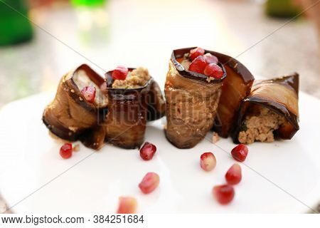 Eggplant Rolls With Nuts On Plate